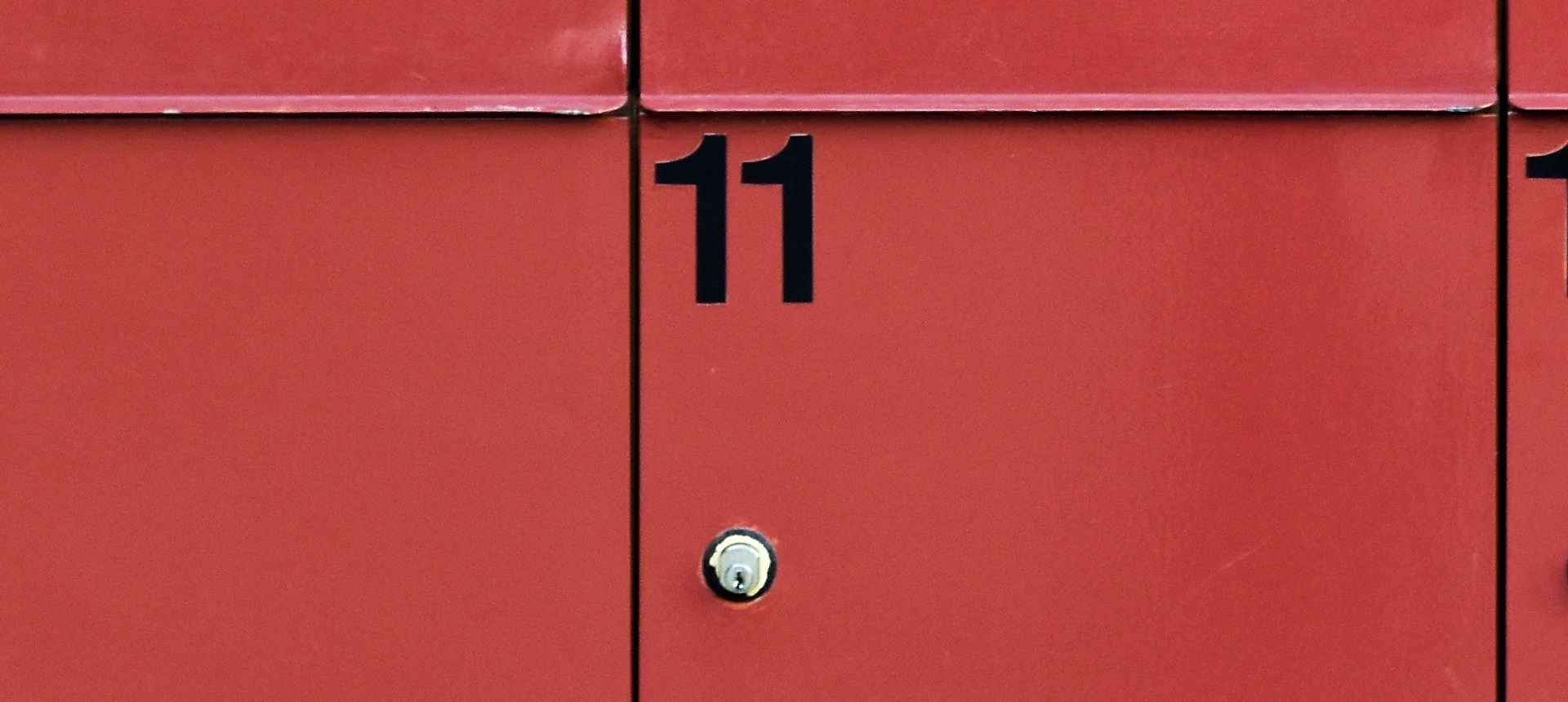 A storage locker with the number 11. Photo by Waldemar on Unsplash